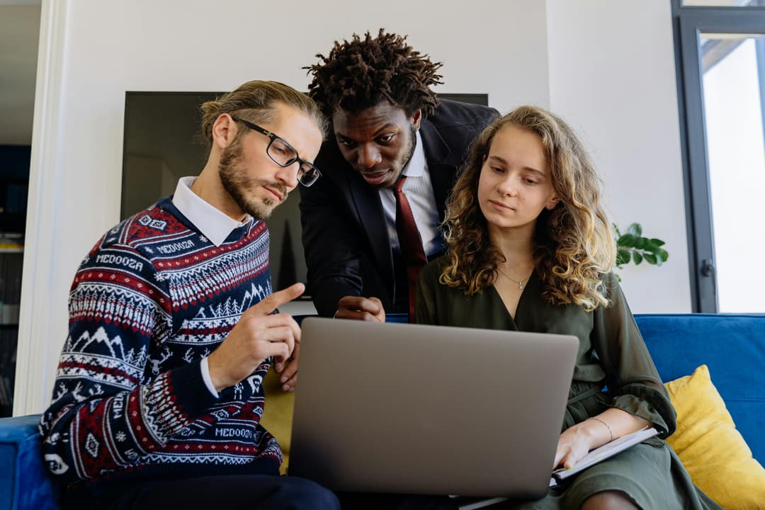 People looking at laptop